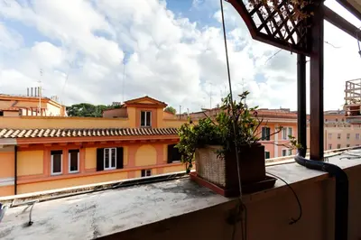 a potted plant sitting on the ledge of a building at CAVALLEGGERI HOUSE in Rome