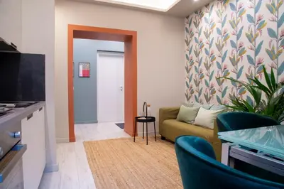 a living room with a couch and a tv at Arezzo 38 in Rome