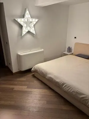 a bedroom with a bed and a star on the wall at Boutique rooms trastevere in Rome