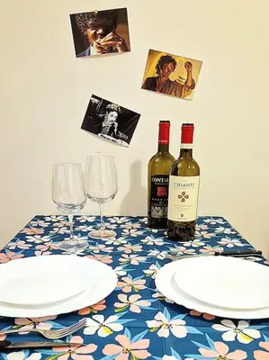 a table with two bottles of wine and two glasses at MusicArt House in Rome