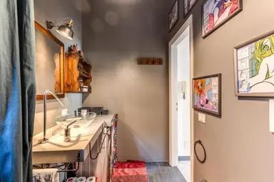 a bathroom with a sink and a mirror at Cozy Flat in Vatican Area with private terrace in Rome