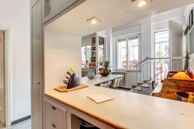 a kitchen with white walls and a counter top at Cozy Flat in Vatican Area with private terrace in Rome