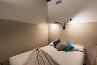 a bedroom with two beds with pillows on them at iFlat Pantheon 's Gem in Rome