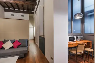 a living room with a couch and a table at iFlat Pantheon 's Gem in Rome