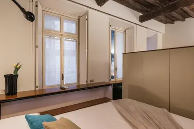 a bedroom with a bed and a window at iFlat Pantheon 's Gem in Rome