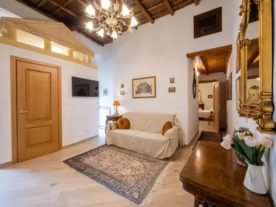 a living room with a couch and a table at Minerva House Pantheon in Rome