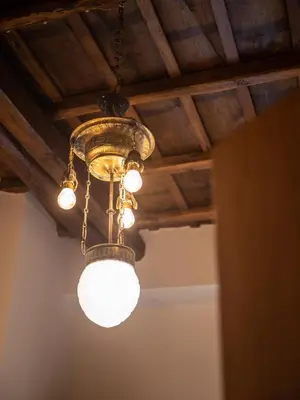 a chandelier hanging from a ceiling in a room at Minerva House Pantheon in Rome