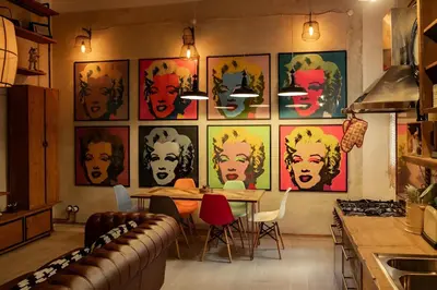 a kitchen with a table and a bunch of pictures on the wall at Lucky Jazz BuddyRent in Rome