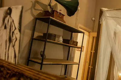 a shelf in a room with some items on it at Lucky Jazz BuddyRent in Rome