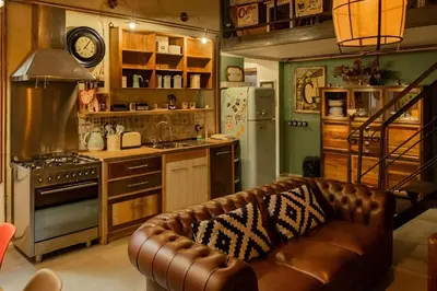 a living room with a couch in a kitchen at Lucky Jazz BuddyRent in Rome