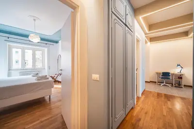 a bedroom with a bed and a desk at St. Peter Twilight BuddyRent in Rome
