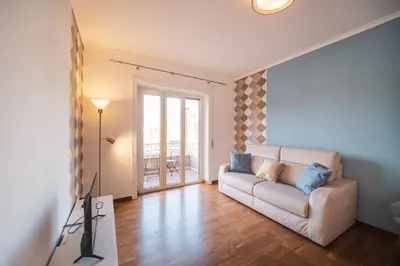 a living room with a couch and a window at St. Peter Twilight BuddyRent in Rome