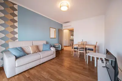 a living room with a couch and a table at St. Peter Twilight BuddyRent in Rome