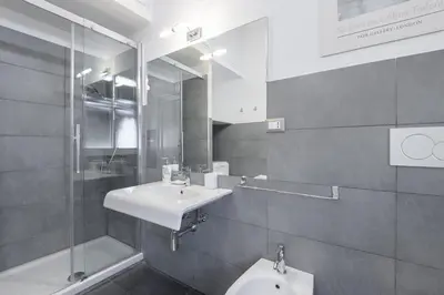 a bathroom with a sink and a mirror at Charming Apartment Piazza del Popolo in Rome