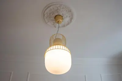 a light fixture hanging from a ceiling at Giò House - Palazzo Storico in Rome