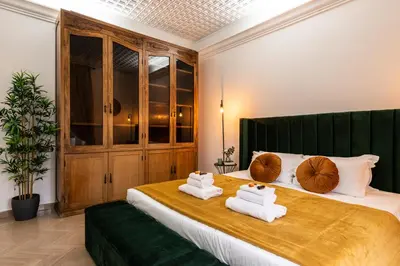 a bedroom with a large bed with towels on it at Appartamento via di Porta Labicana in Rome