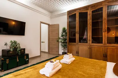 a room with two pairs of shoes on a table at Appartamento via di Porta Labicana in Rome