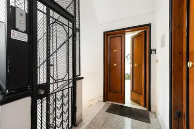 an entrance to a house with a gate and a door at Appartamento via di Porta Labicana in Rome