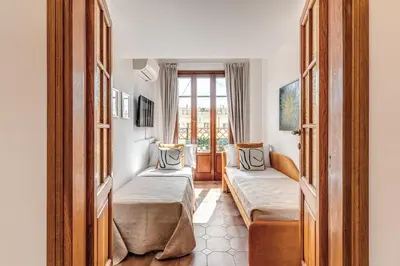a hotel room with two beds and a window at Twilight Terrace - Piazza di Spagna in Rome