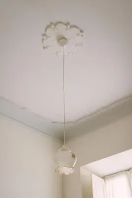 a chandelier hanging from a ceiling in a room at Appartamento Roma Vaticano 