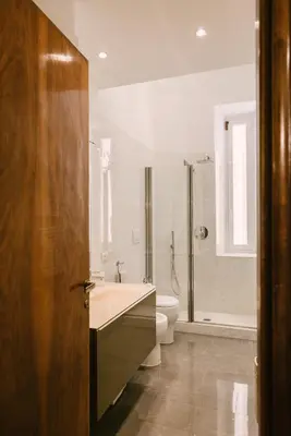 a bathroom with a sink and a toilet at Appartamento Roma Vaticano 