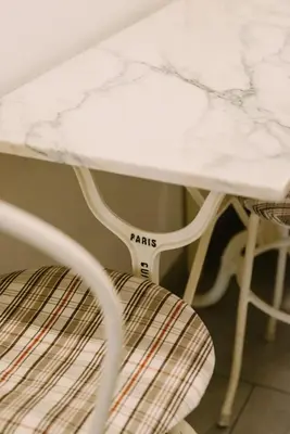 a white table and a chair with a marble top at Appartamento Roma Vaticano 
