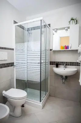 a bathroom with a shower and a toilet and a sink at Vatican Rooms Holiday in Rome in Rome
