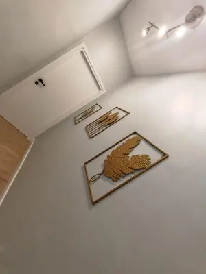 a room with three plates on the wall at Domus Aldini in Rome