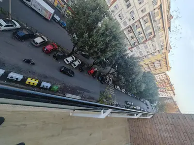 an overhead view of a busy city street with cars at Domus Aldini in Rome