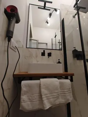 a bathroom with a sink and a mirror at Domus Aldini in Rome
