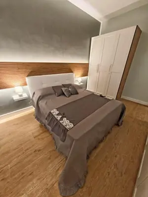 a bedroom with a large bed in a room at Domus Aldini in Rome