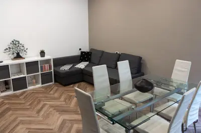 a living room with a glass table and a couch at Casa Matteo53, Termini in Rome