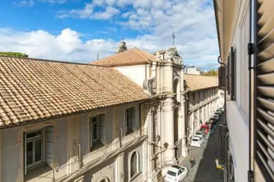 a view of a city street with buildings and cars at Trastevere Luxury Home in Rome