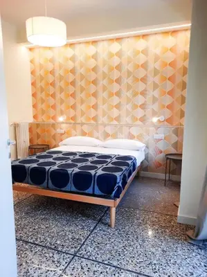 a bedroom with a bed in a room at RomAntica Lemon Apartment in San Giovanni in Rome