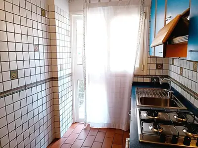 a small kitchen with a sink and a window at Appartamento per le tue vacanze a Roma Villa Pamphili in Rome