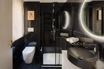 a bathroom with a toilet and a sink at Pop Corn Vatican Suites in Rome
