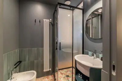a bathroom with two sinks and a shower at Vatican Night Suites in Rome