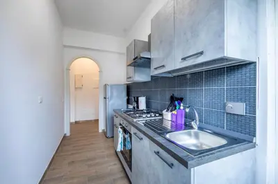 a kitchen with a sink and a counter top at CASA LINO in Rome