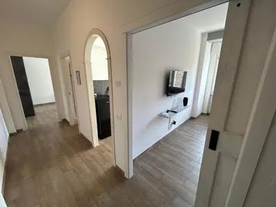 an empty hallway with an archway in a room at CASA LINO in Rome