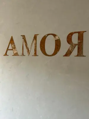 a sign that says amazon on a wall at CASA LINO in Rome
