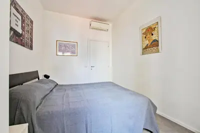 a bedroom with a bed in a white room at [Roma centro Storico * * * * *]- Via Torino Suite in Rome