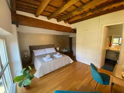 a bedroom with a bed with two towels on it at Margutta Domitia Home in Rome