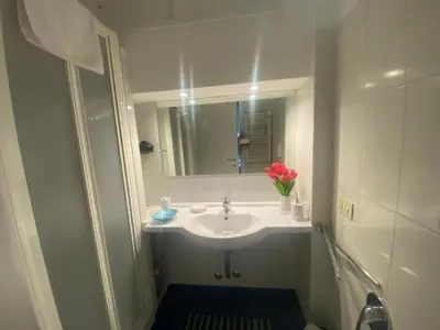 a bathroom with a sink and a mirror at Margutta Domitia Home in Rome