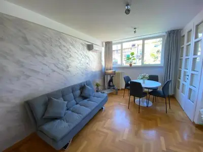 a living room with a couch and a table at Margutta Domitia Home in Rome