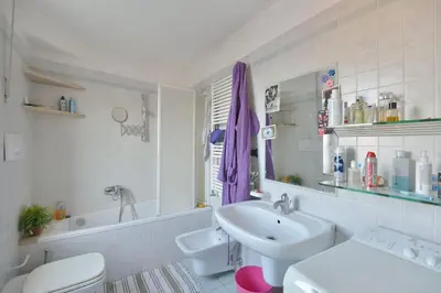 a bathroom with a sink and a toilet and a tub at SUPER SUNNY PENTHOUSE WITH TERRACE in Rome
