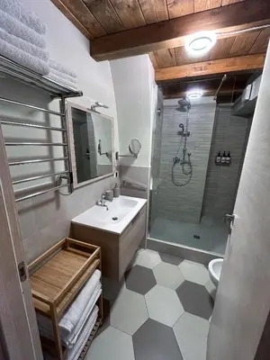 a bathroom with a sink and a shower at LOFT 125 passi dal Colosseo in Rome