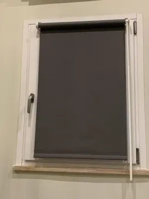 a window with a black door on a wall at LOFT 125 passi dal Colosseo in Rome