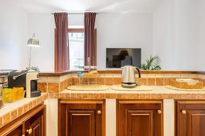 a kitchen counter with a sink and a microwave at Attico Campo de Fiori Katia in Rome