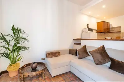 a living room with a couch and a table at Attico Campo de Fiori Katia in Rome