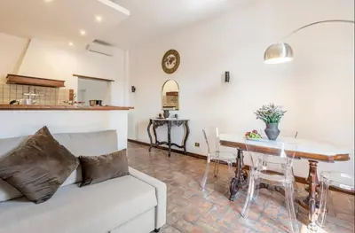 a living room with a couch and a table at Attico Campo de Fiori Katia in Rome